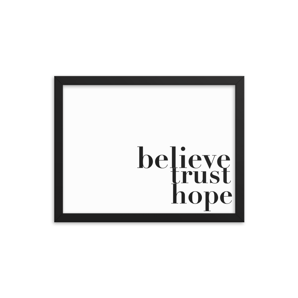 A white poster with the words, believe, trust , hope; written in black
