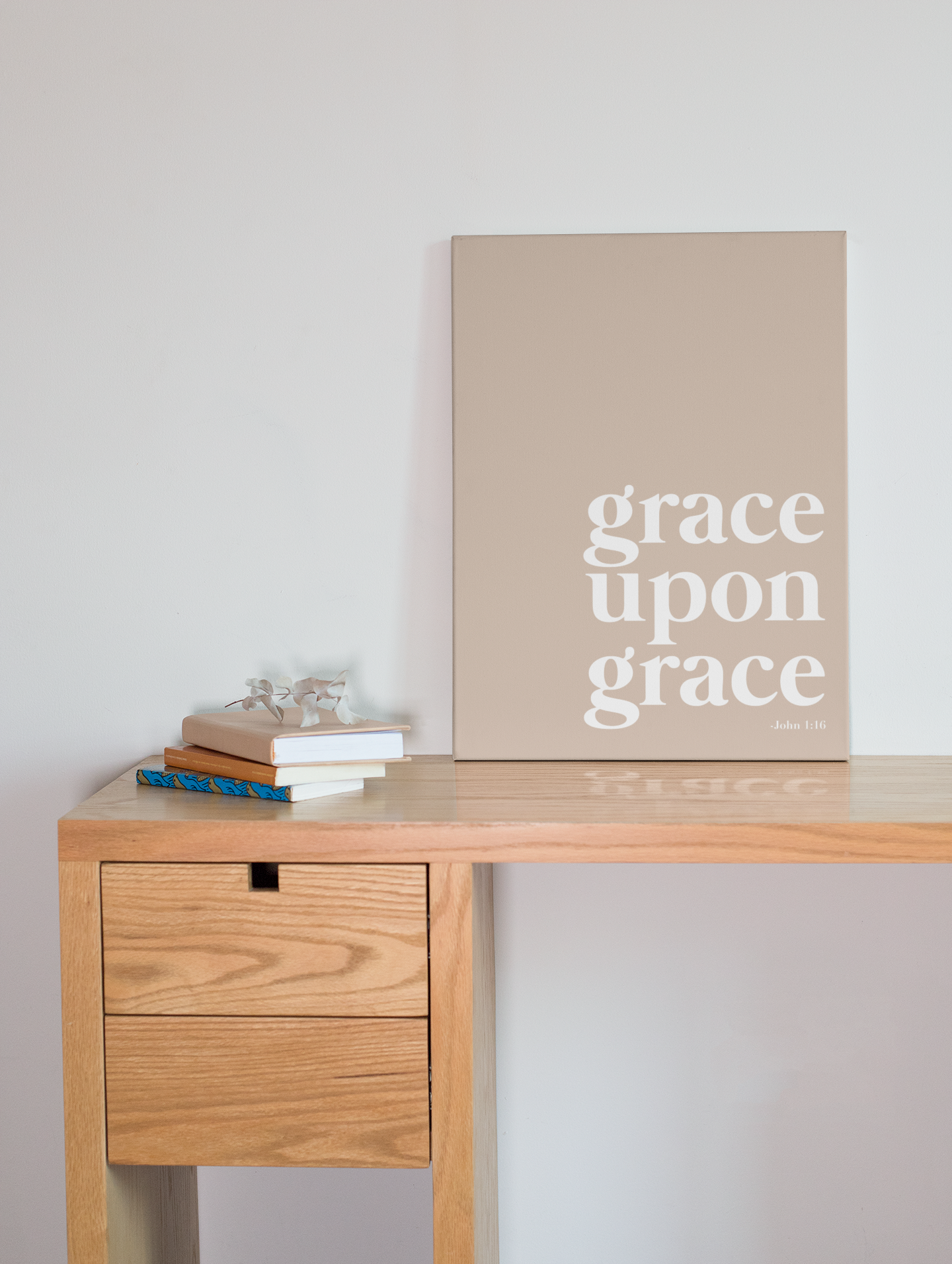 A canvas with the words grace upon grace written on it. 